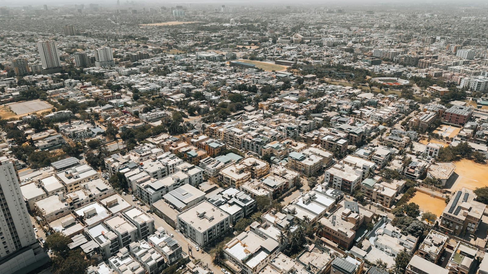 Aerial view of rooftops across a dense Karachi neighbourhood
