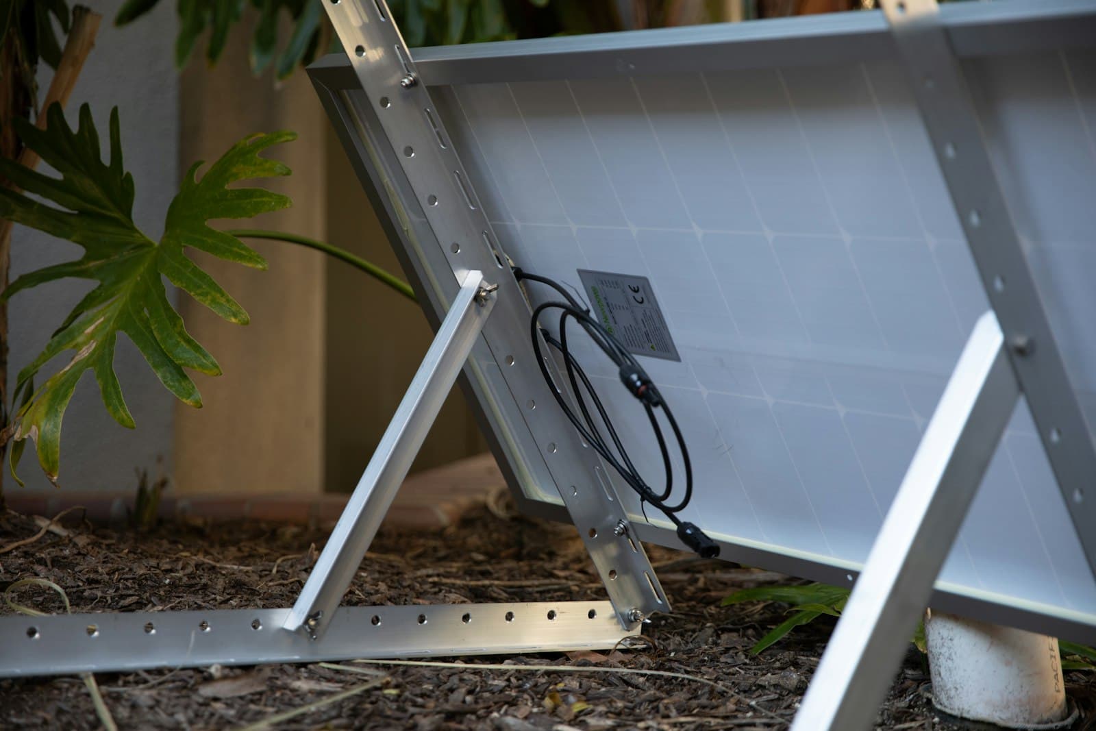 The back of a solar panel showing its junction box and MC4 cables